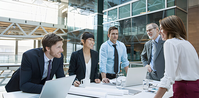 group of persons at a desk